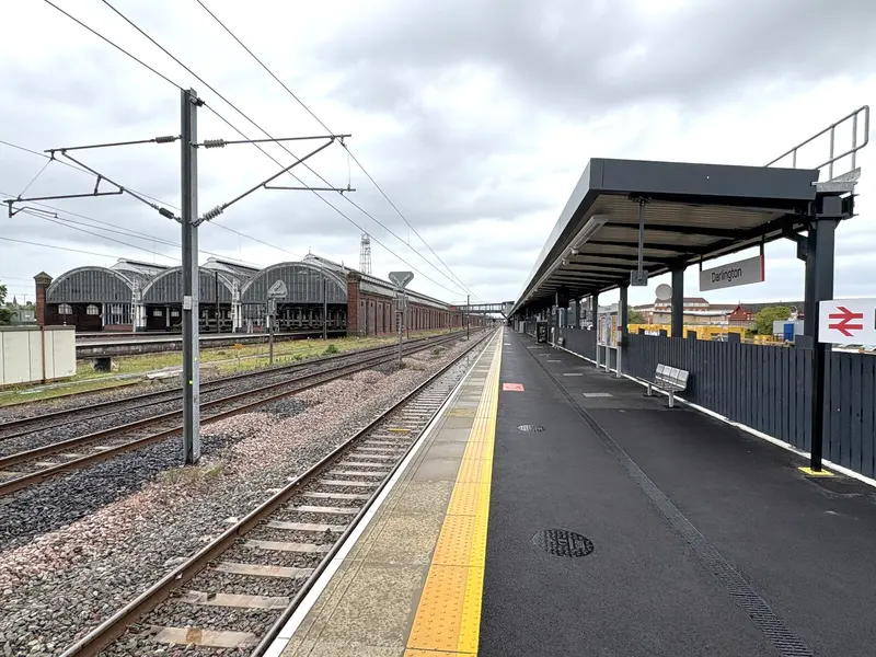 One of Darlington's new platforms with a modern canopy, looking back towards the Victorian train shed