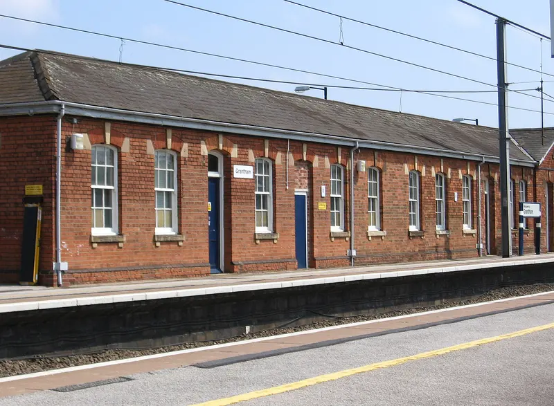 The long red-brick station building on platform 1 at Grantham, with sash windows and a slate roof