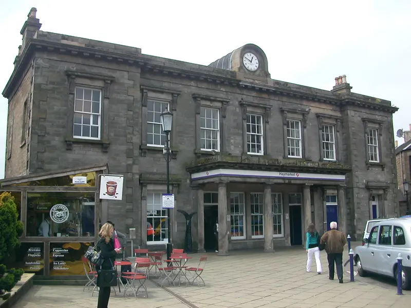 Haymarket's two-storey sandstone station building of 1840–42, with a Tuscan portico and a clock above the cornice