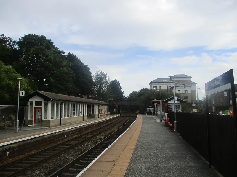 Platforms at Horsforth station curving towards the Station Road bridge