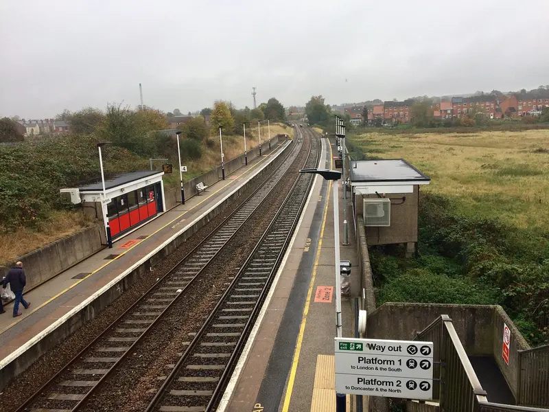 The two low-level platforms at Retford seen from above, with shelters and a sign pointing the way out to platforms 1 and 2