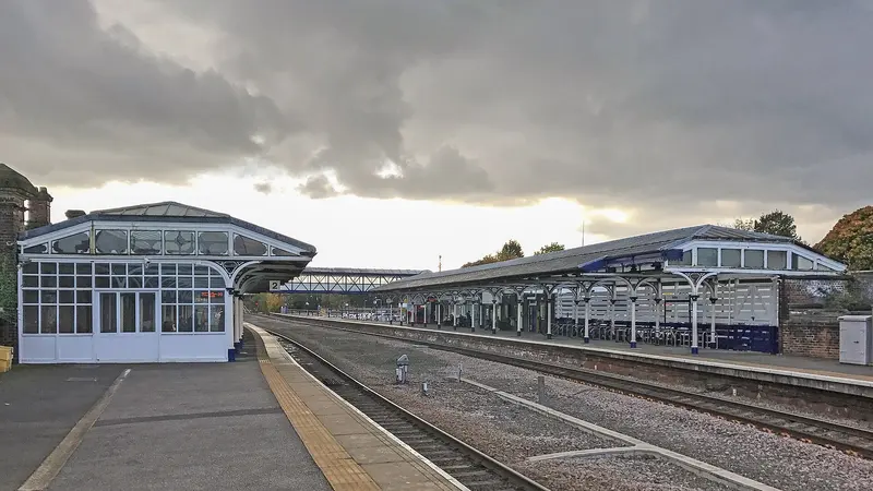 Glazed Victorian canopies on both platforms at Selby station under a cloudy sky