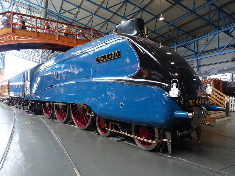 The blue streamlined steam locomotive Mallard on display in the Great Hall